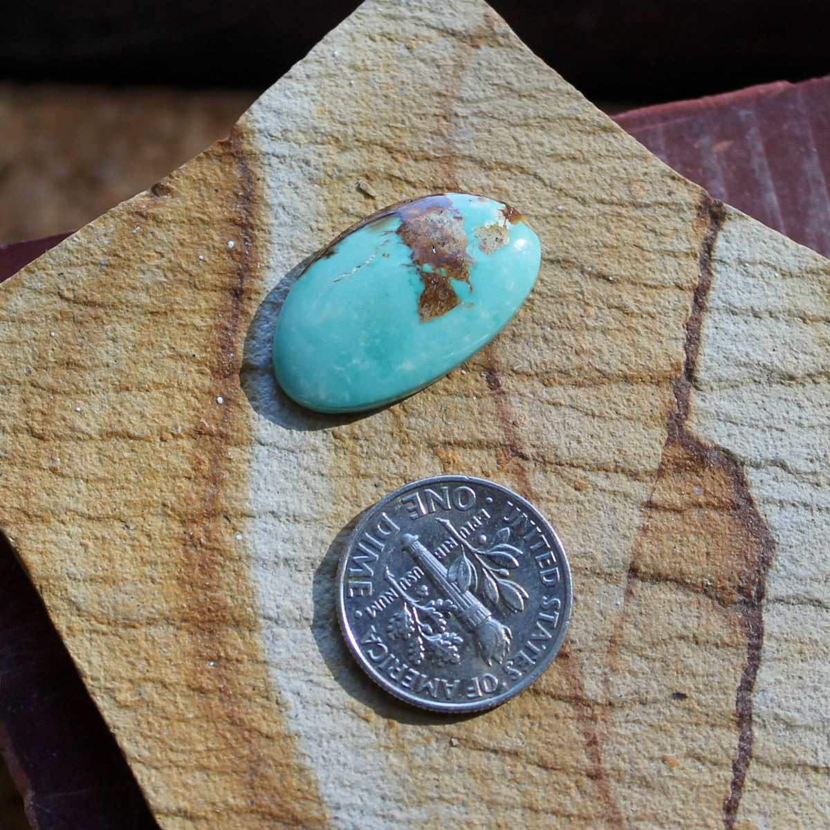 9.7 carat blue Stone Mountain Turquoise cabochon with red matrix
