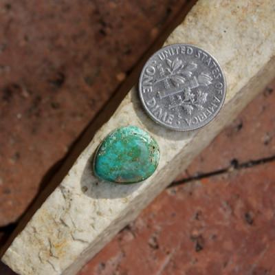 A turquoise nugget cut into a turquoise cabochon with nice depth