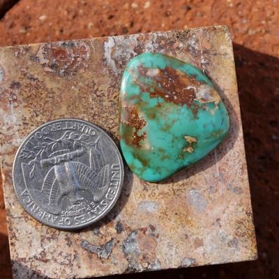 Green-teal with red matrix on this natural Nevada turquoise cabochon