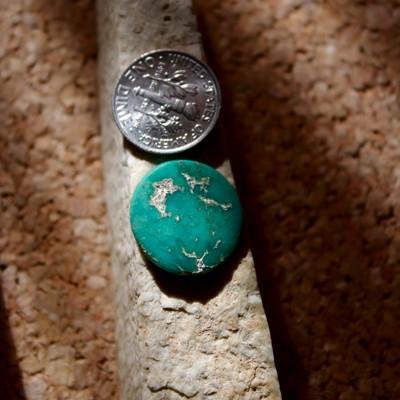Deep teal-green color cut round from natural Stone Mountain Turquoise